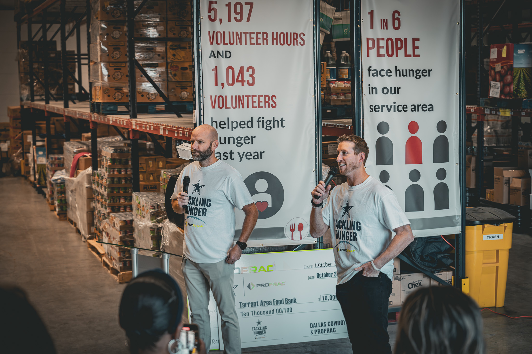 Matt Wilks and Ladd Wilks are speaking at the Tarrant Area Food Bank during a charitable event before donating to the cause.
